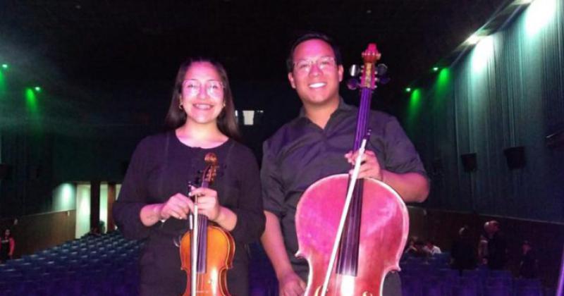 Aldana López y Claudio Martínez músicos que se iniciaron en la Orquesta Infanto Juvenil Municipal de barrio Kennedy